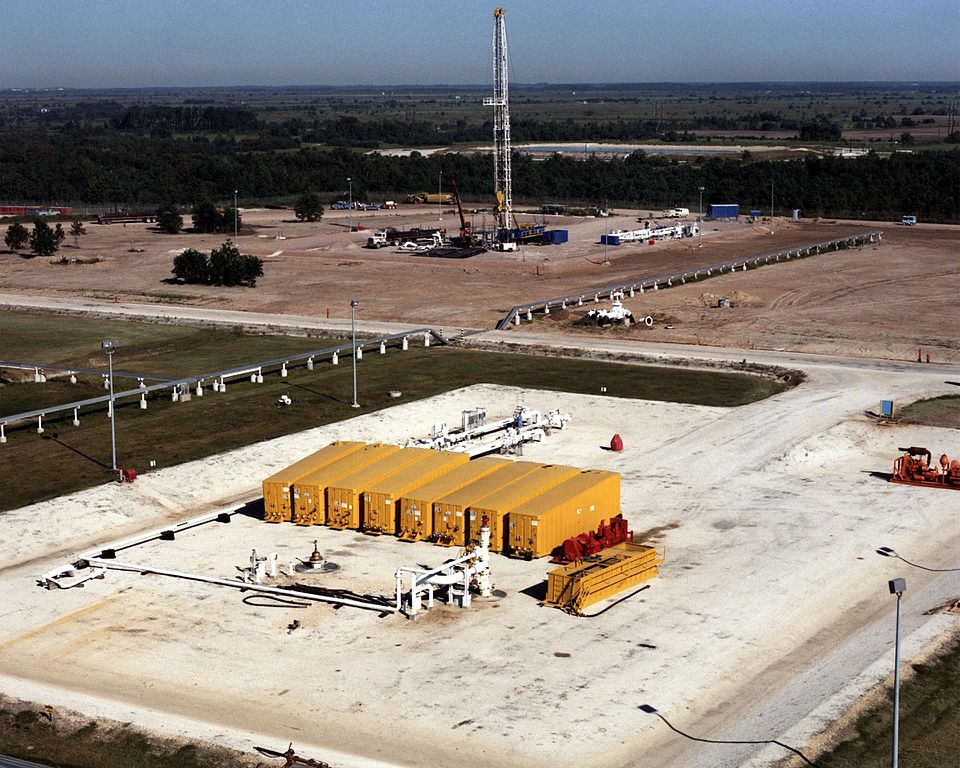 Well pads with frac tanks and work-over rig at the Big Hill Strategic Petroleum Reserve storage site, Texas