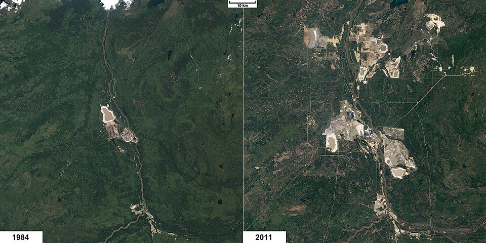 NASA satellite comparison of Athabasca oil sands mining region in 1984 versus 2011, showing dramatic expansion of open-pit mines and tailings ponds
