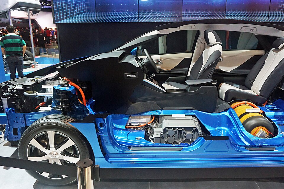 Cutaway display of the Toyota Mirai showing the fuel cell stack and compressed hydrogen tanks